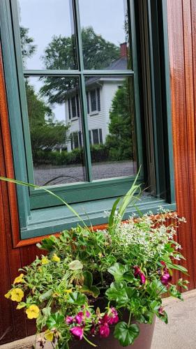 Main House reflection in Carriage House window